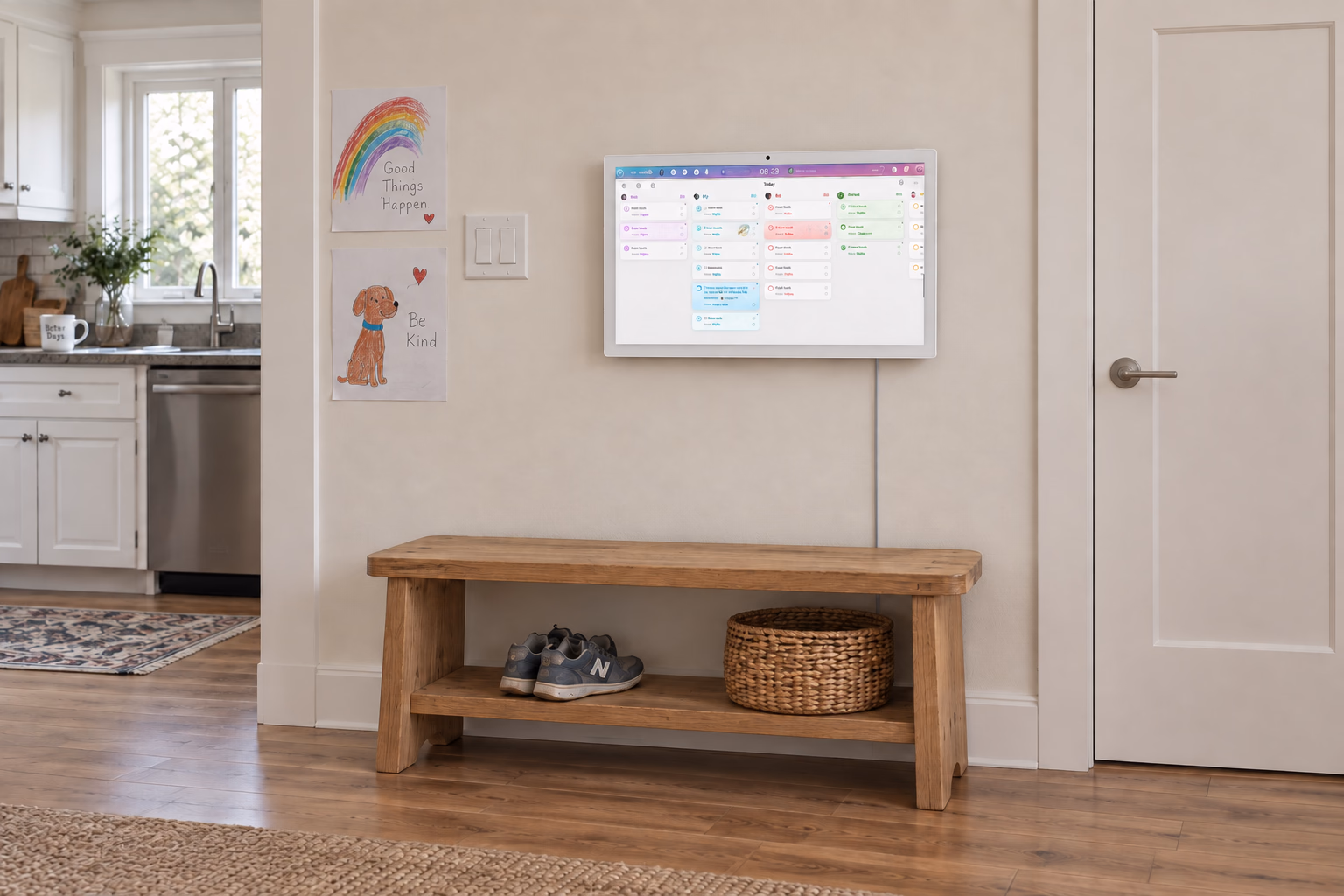Odic Board displaying family tasks above a wooden entryway bench, beside children's drawings